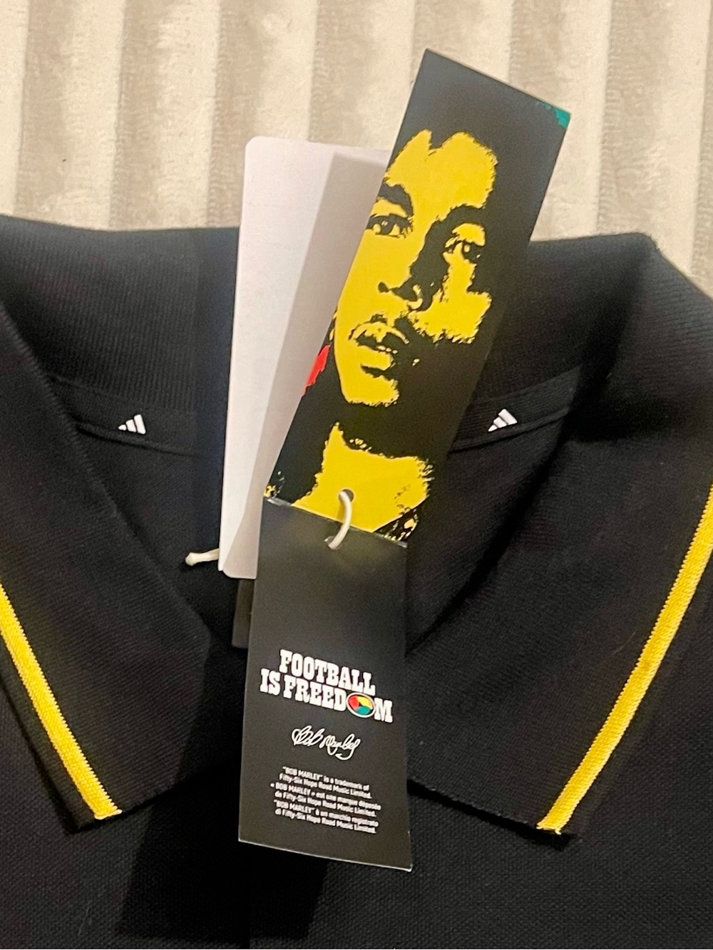 Adidas Black Polo Shirt with Red, Yellow and Green Accents